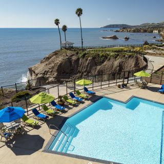 Largest heated oceanfront pool in Pismo Beach overlooks the bluffs and gazebo at Shore Cliff Hotel