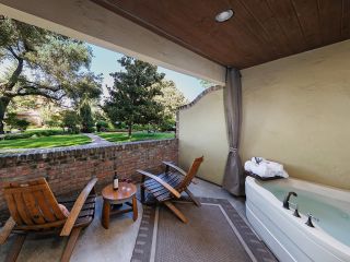 Paso Robles Inn private patio with Adirondack chairs and a bathtub