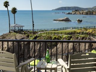 Oceanfront balcony overlooking Shore Cliff Hotel pool and Pismo Beach CA bluffs