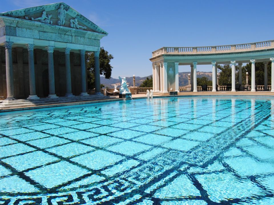 A Large Pool Of Water In Front Of Hearst Castle
